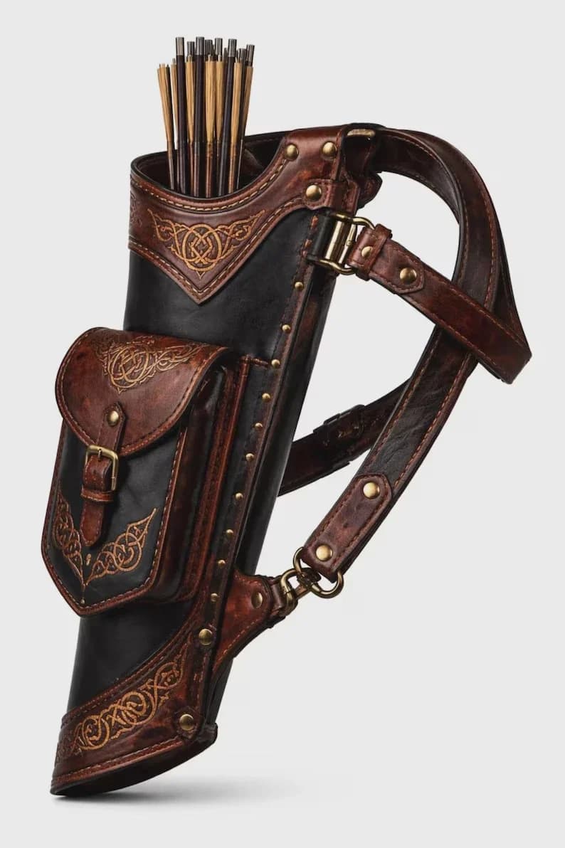 Field leather back quiver in black and brown with tooled Celtic pattern, brass hardware and arrows